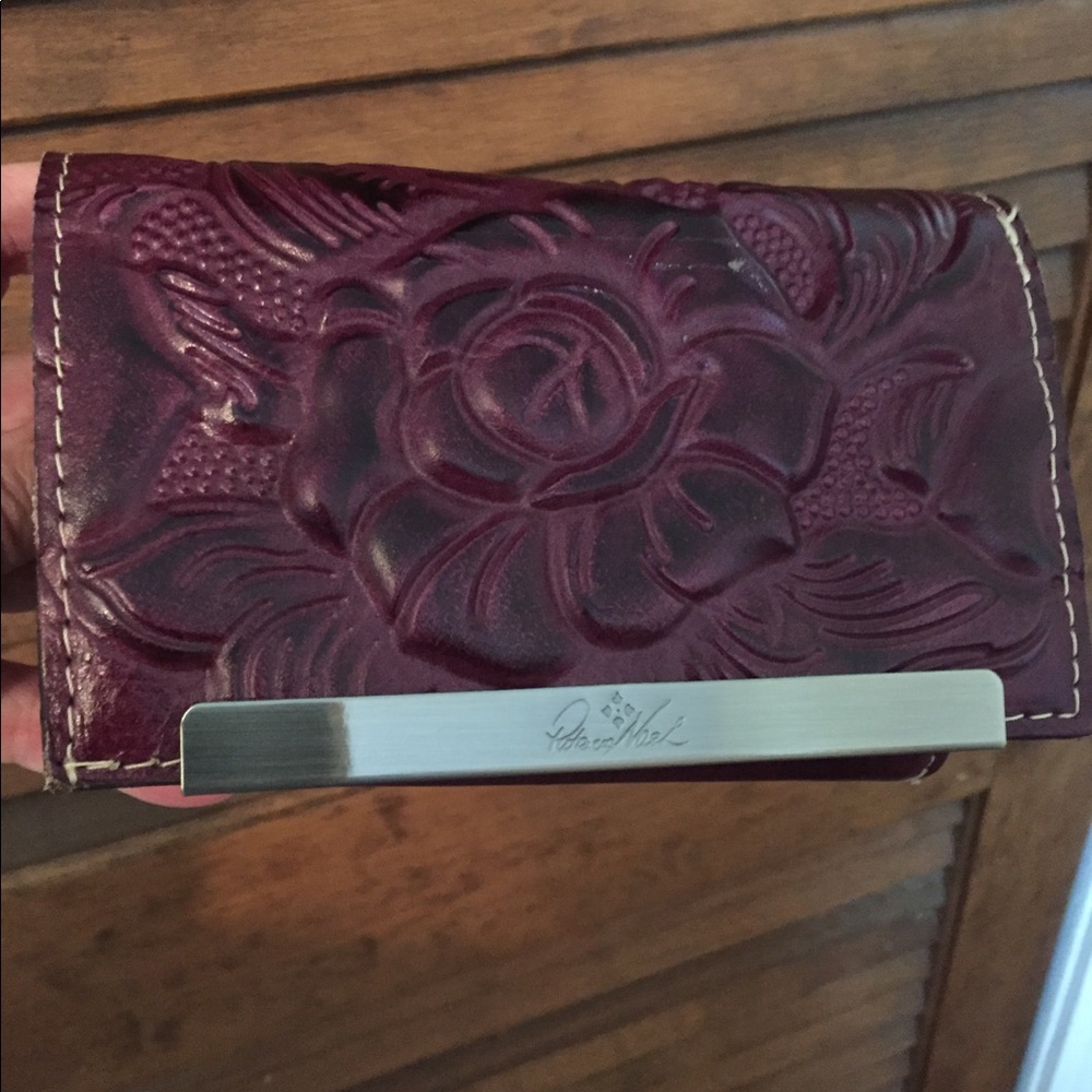 Patricia Nash plum all leather wallet.